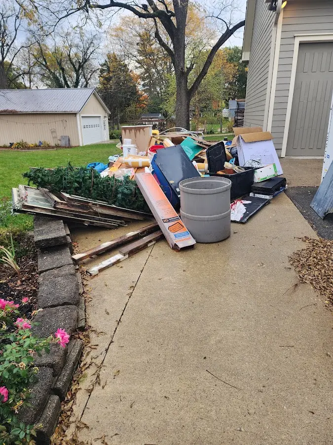 Dumpster being loaded with debris for Residential Dumpster Rental in Montclair